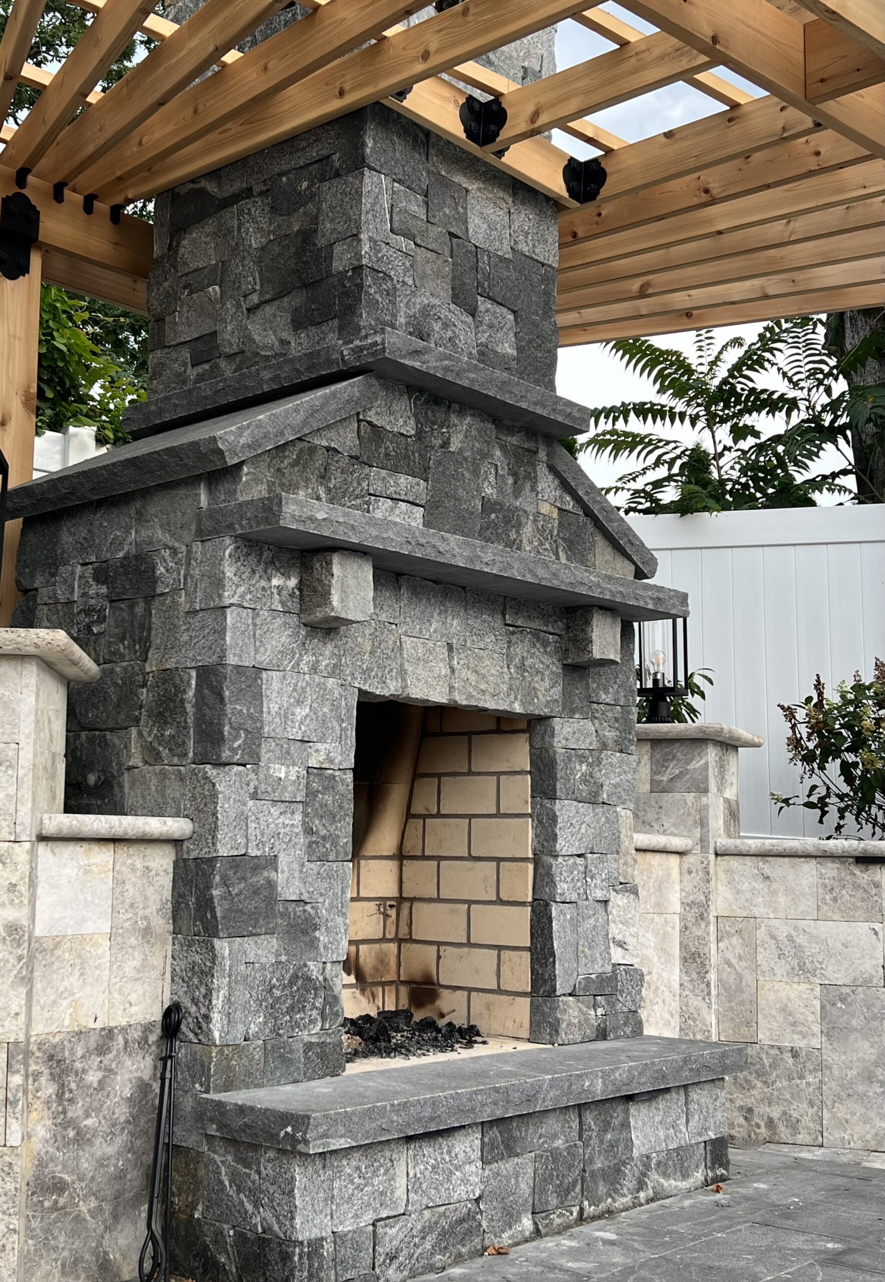 Cromwell Valley Natural Stone Veneer installed on an outdoor fireplace