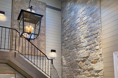 Custom-Crystal-Creek-Blend-crop Custom Natural Facing stone veneer blend installed as an accent wall near a stairway
